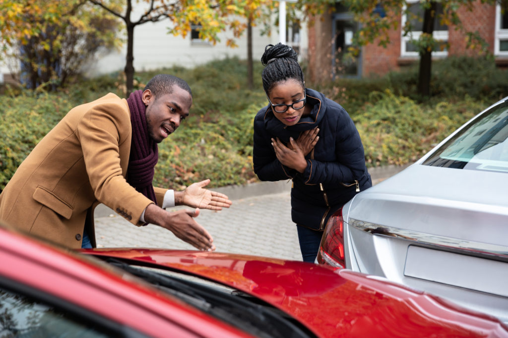 Delayed Injuries from a Car Accident - Man And Woman Arguing With Each Other After Car Accident